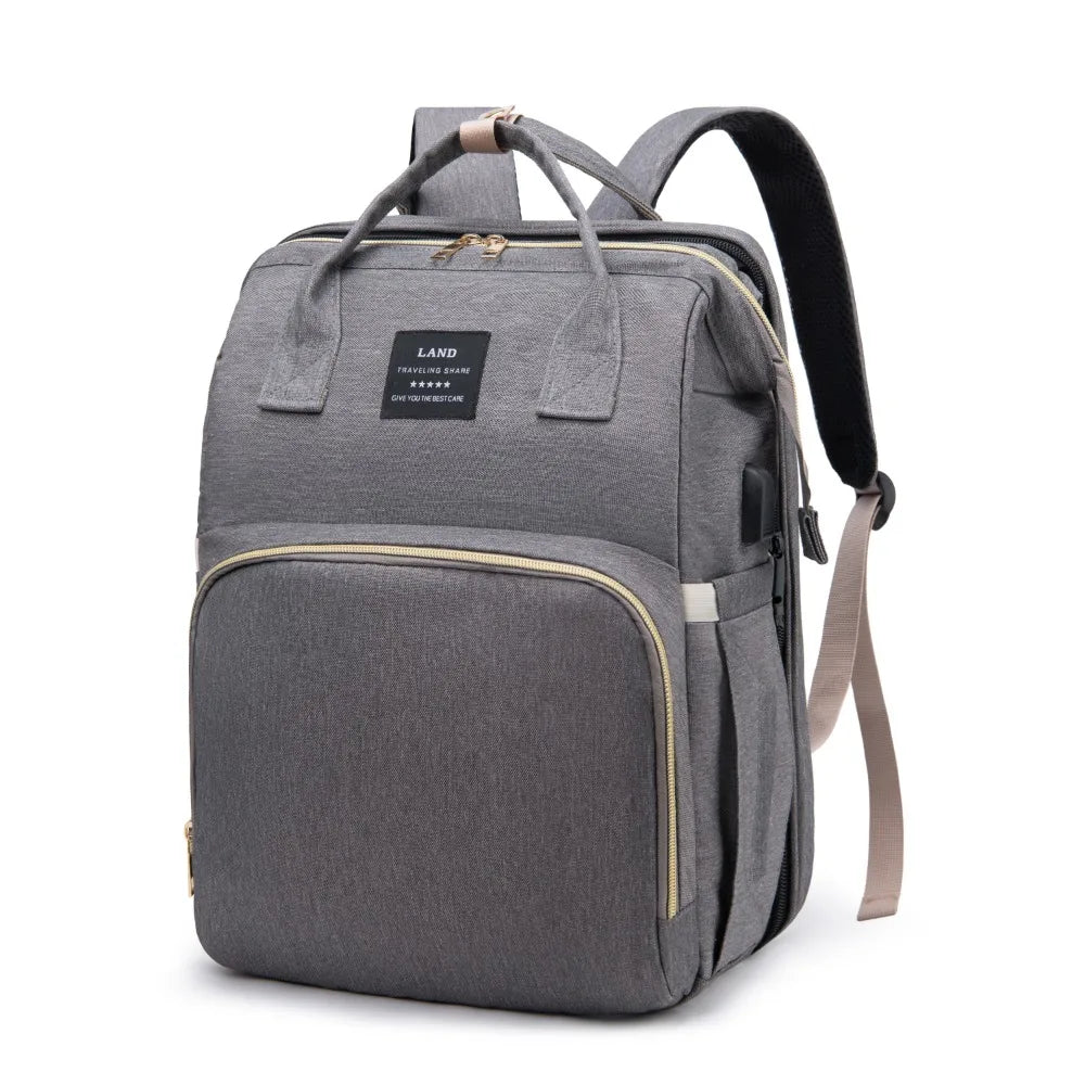 Bolsa de viaje todo en uno para mamá con cuna y almacenamiento de artículos esenciales para bebé